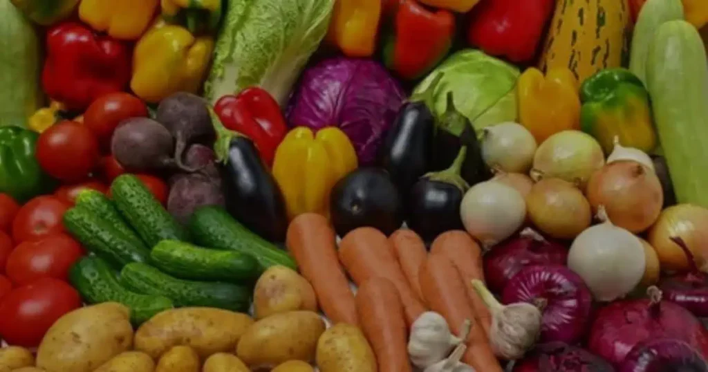 Different vegetables are placed on table.