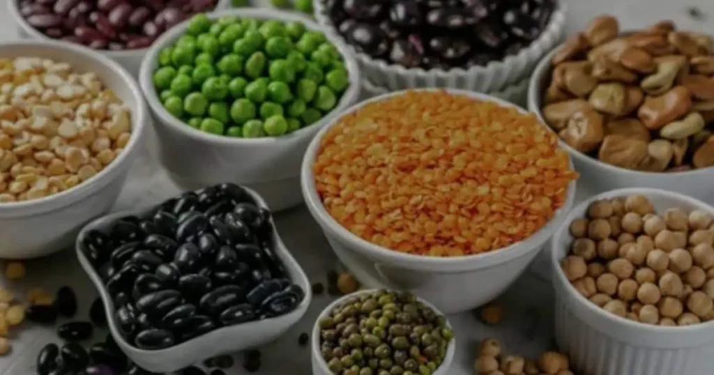 Pulses used in katiawadi kitchen are placed on a wooden table.