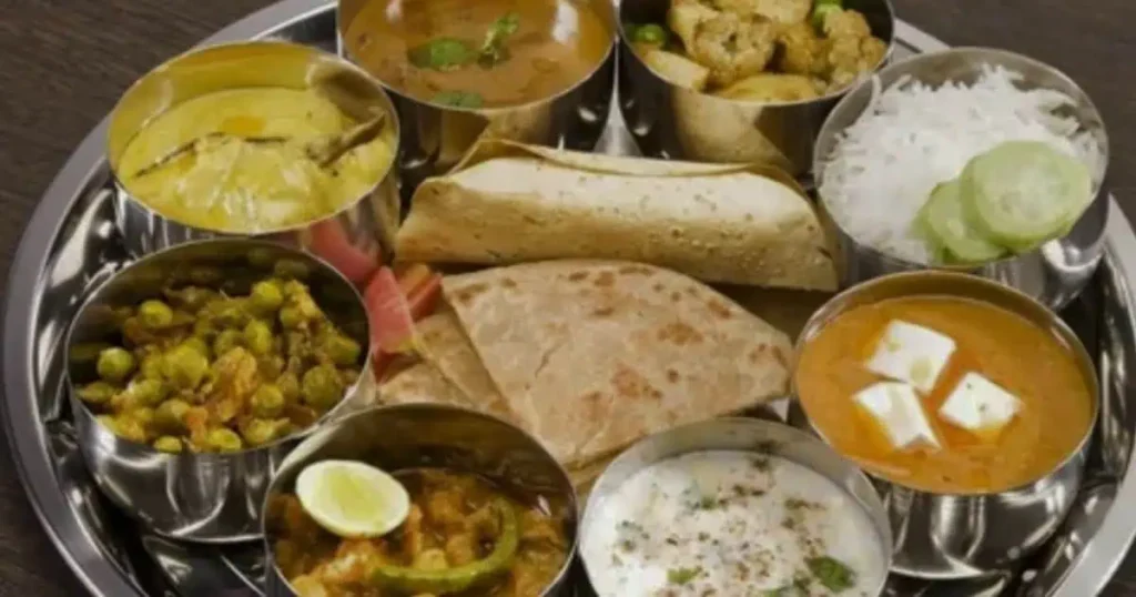 Kathiawadi food plate with roti,daal,salad,yogurt etc.