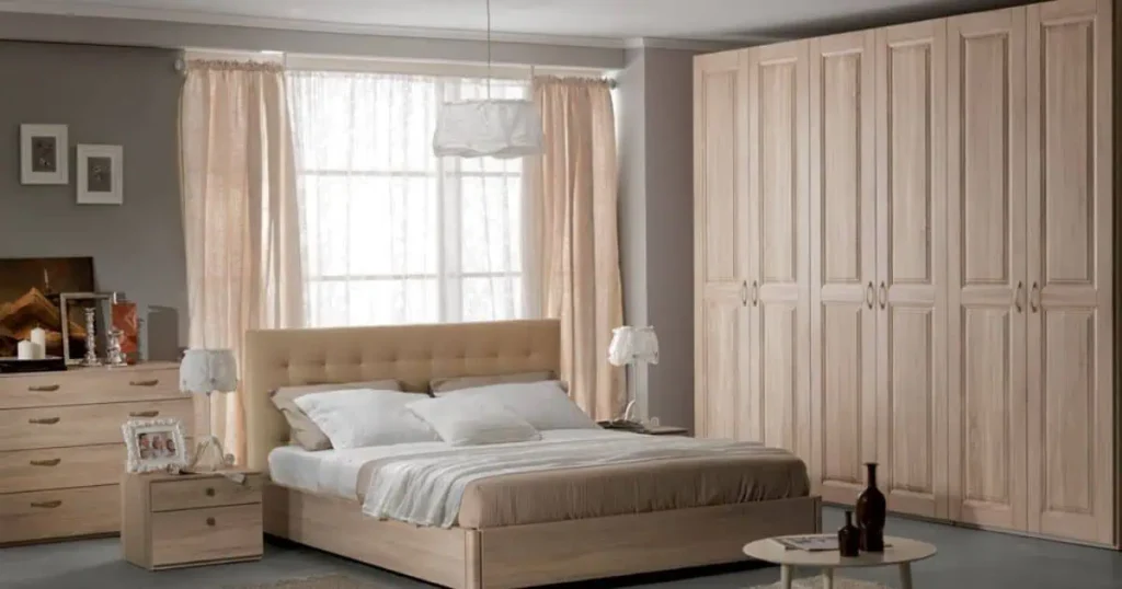 A cozy bedroom featuring a bed, dresser, and wardrobe, showcasing elegant pink assets for a stylish ambiance.